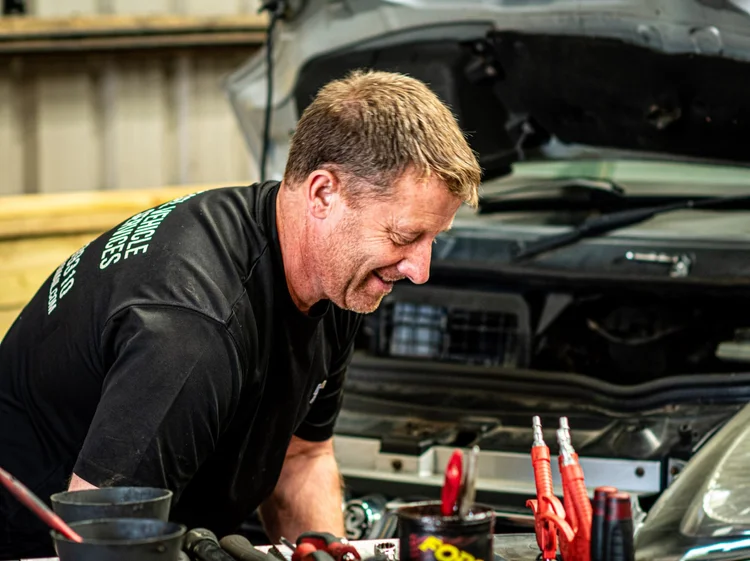 Mechanic working on a diesel engine